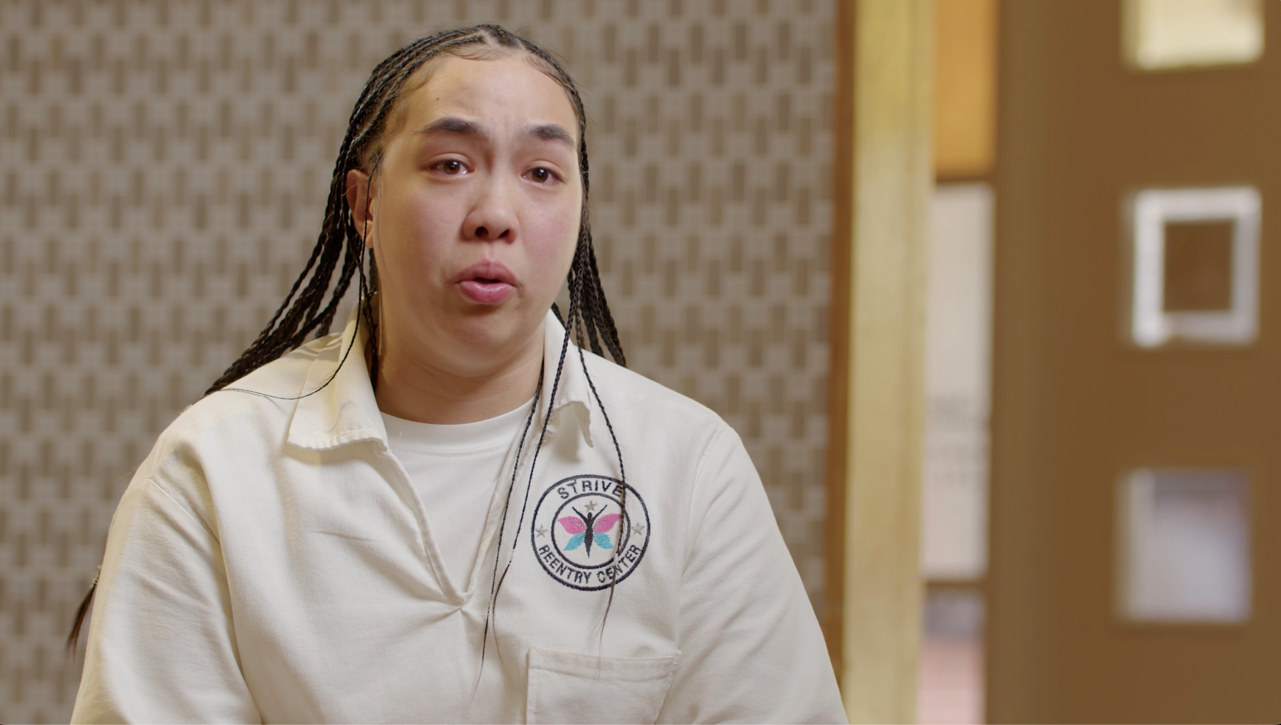 Woman in Strive Reentry Center uniform speaking emotionally